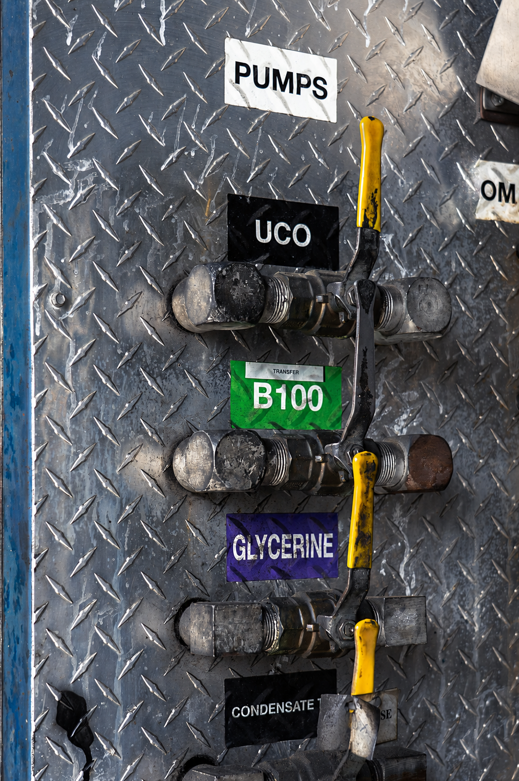 Pump manifold panel labelled UCO, B100, and Glycerine at Consolidated Biofuels facility